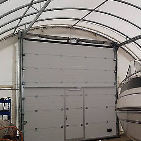 sectional gate in a tent hangar ULA